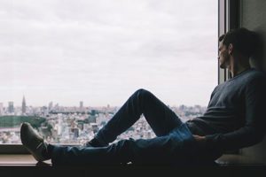 Man sitting in window